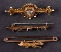 Three bar brooches, including a brooch with a motif of a running fox,