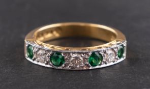 An 18ct gold, round, mixed-cut emerald and round, brilliant-cut diamond, half eternity ring,