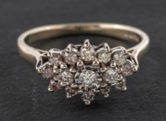 An 18ct gold, round, brilliant-cut diamond cluster ring, total estimated diamond weight ca. 0.