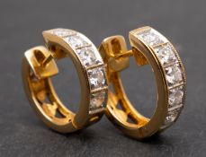 A pair of round, brilliant-cut diamond hoop earrings, total estimated diamond weight ca.