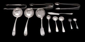 A mixed group of early 19th century flatware to include; a pair of Fiddle and Shell sugar tongs,