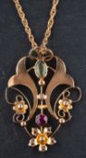 An openwork, gemset 1 pendant, with floral motifs, stamped '9' length of pendant ca.