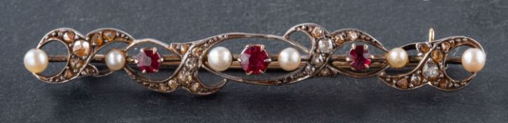 A round, mixed-cut ruby, seed pearl and rose-cut diamond brooch, total estimated diamond weight ca.