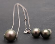 A cultured 'Tahitian' pearl necklace and pair of cultured, 'Tahitian', pearl ear studs,