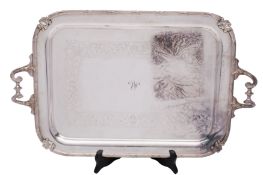 An Edward VII silver plated twin-handled tea tray, rectangular with engraved foliate scroll band,