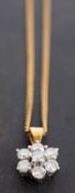 An 18ct gold, round, brilliant-cut diamond pendant, of flowerhead design,