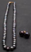 A single-row, cultured 'Tahitian' pearl necklace and pair of cultured, 'Tahitian', button,