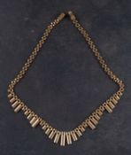 A panther-link, stepped-fringe necklace, stamped '375', total length ca. 43cm, total weight ca. 17.