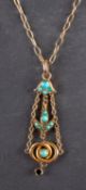 A cabochon-cut turquoise pendant, with floral motifs, together with a 9ct gold, cable-link chain,