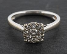 A 9ct gold, round, brilliant-cut diamond cluster ring, total diamond weight 0.