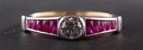 An 18ct gold, round, brilliant-cut diamond and calibre-cut ruby ring, estimated diamond weight ca.