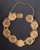 A bracelet of circular plaques, inscribed with auspicious Chinese characters,