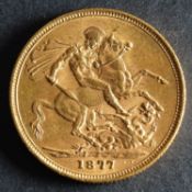 An 1877 Victorian Gold Sovereign of Melbourne Mint.