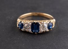 A rectangular cushion and round, mixed-cut sapphire and old-cut diamond, five-stone ring,