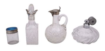 A group of silver and glass bottles, comprising a German silver claret jug, maker ELIMEYER,