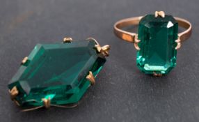 A green paste ring and pendant, both stamped '9CT', ring size L, length of pendant ca. 3.