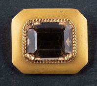 An octagonal, step-cut, smokey quartz brooch, estimated quartz weight ca. 38cts, total length ca. 3.