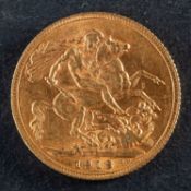 A George V gold sovereign coin, dated 1913, diameter ca. 22mms, total weight ca. 7.9gms.