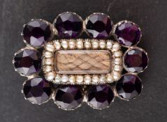 A 19th century, purple paste, seed pearl and hairwork cluster brooch/ pendant, total length ca. 2.