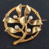 A French, circular, openwork, seed pearl brooch, with floral motif,