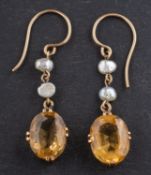 WITHDRAWN A pair of cultured fresh-water pearl and oval, mixed-cut citrine drop earrings,