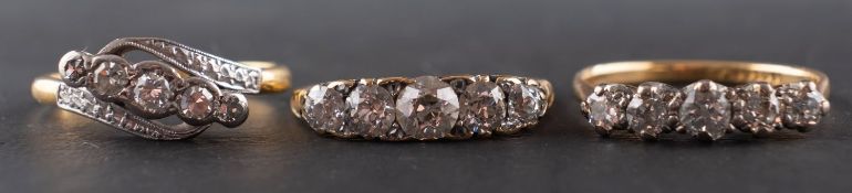 Three five-stone diamond rings, including a ring stamped '18CT & PLAT',