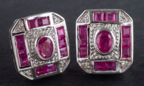 A pair of calibre-cut ruby and single-cut diamond ear studs, of octagonal design, stamped '14K',