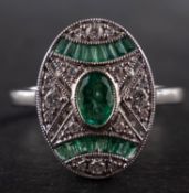 An 18ct gold, calibre and oval, mixed-cut emerald and round, brilliant-cut diamond ring,