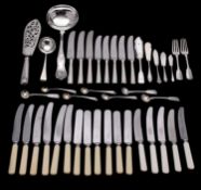 A quantity of silver and silver plated flatware to include: eight table knives with hallmarked
