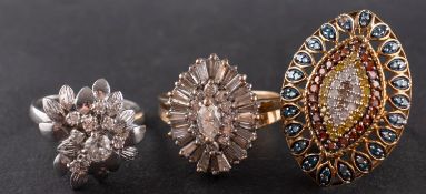 Three diamond rings, including an 18ct gold, flowerhead ring, total estimated diamond weight ca. 0.