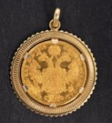 An Austrian-Hungarian Ducat re-strike gold coin, dated 1915, mounted as a pendant, stamped '585',