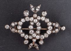 A late 19th/early 20th century single and old-cut diamond, openwork brooch,