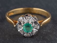 An 18ct gold, round, mixed-cut emerald and single-cut diamond cluster ring,
