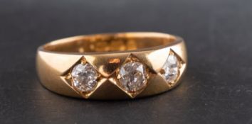 An 18ct gold, old-cut diamond three-stone ring, total estimated diamond weight ca. 0.
