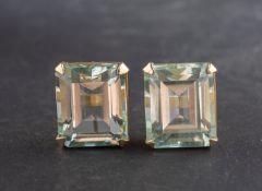 A pair of octagonal, step-cut aquamarine ear studs, total estimated aquamarine weight ca. 12.