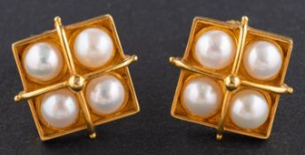 A pair of square, quadrapartite, cultured button pearl ear studs, stamped '750' with post fittings,