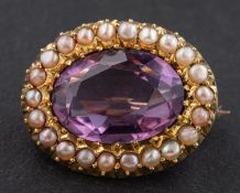 An oval, mixed-cut amethyst brooch, with seed pearl surround, estimated amethyst weight ca. 4.