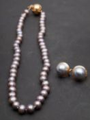 A single-row, cultured 'Tahitian' pearl necklace and pair of mabe, 'Tahitian' pearl ear studs,