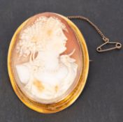 A shell cameo brooch, depicting the bust of a lady in profile, stamped '9CT', total length ca. 5.