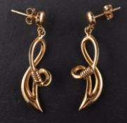 A pair of drop earrings, with reeded spacers, post fittings, stamped '14K', total length ca. 3.