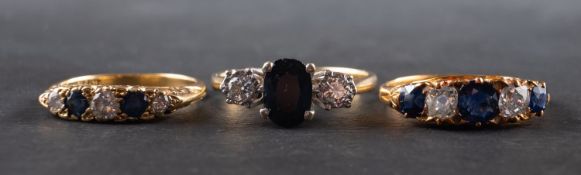 Three sapphire and diamond rings, including a five-stone ring, marked '18',