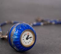 WITHDRAWN An Edwardian enamel and silver ball fob watch the small white dial with Arabic numerals