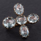 A 19th century, oval, mixed-cut, foil backed, aquamarine cruciform brooch, total length ca. 2.