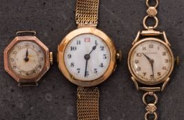 A small 15ct gold wristwatch the white dial with black and red Arabic numerals and blued-steel
