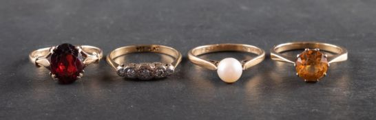 Four gemset rings, including a diamond five-stone ring, stamped '9CT'; a cultured pearl ring,