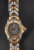 Tag Heuer a lady's stainless-steel wristwatch the grey dial with luminous 'Mercedes' hands,