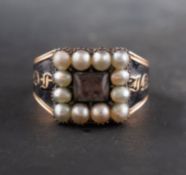 A Georgian mourning ring, glazed hairwork to centre, with seed pearl surround,