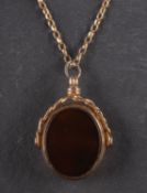 A 9ct gold, bloodstone and onyx swivel fob, length ca. 2.