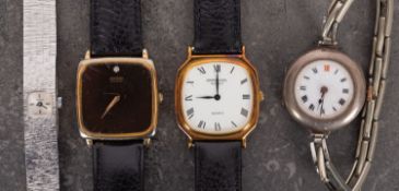 WITHDRAWN A lady's silver cased wristwatch the circular white enamel dial on an expanding bracelet,