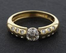 A 14ct gold, round, brilliant-cut diamond ring, estimated weight of principal diamond ca. 0.